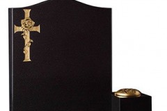This circular polished headstone is flanked by two fully carved angels to create an outstanding example of masonry art - shown in black granite.Headstone 30" (h) x 36" (w) x 5" (d)Base 4" (h) x 42" (w) x 12" (d)Product code - 16070