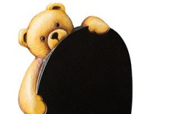The fully carved teddy holding this headstone can be replaced with other characters - shown in black granite.headstone 27" (h) x 21" (w) x 3" (d)Base 3" (h) x 24" (w) x 12" (d)Product code -  16178