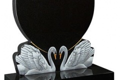 Shaping, sandblasting and painting can be combined by our masons and artists to create beautiful and unique memorials. The swan design show here is a lovely example of this - shown in black granite.headstone 30" (h) x 26" (w) x 3" (d)Base 3" (h) x 30" (w) x 12" (d)Product code -  16113
